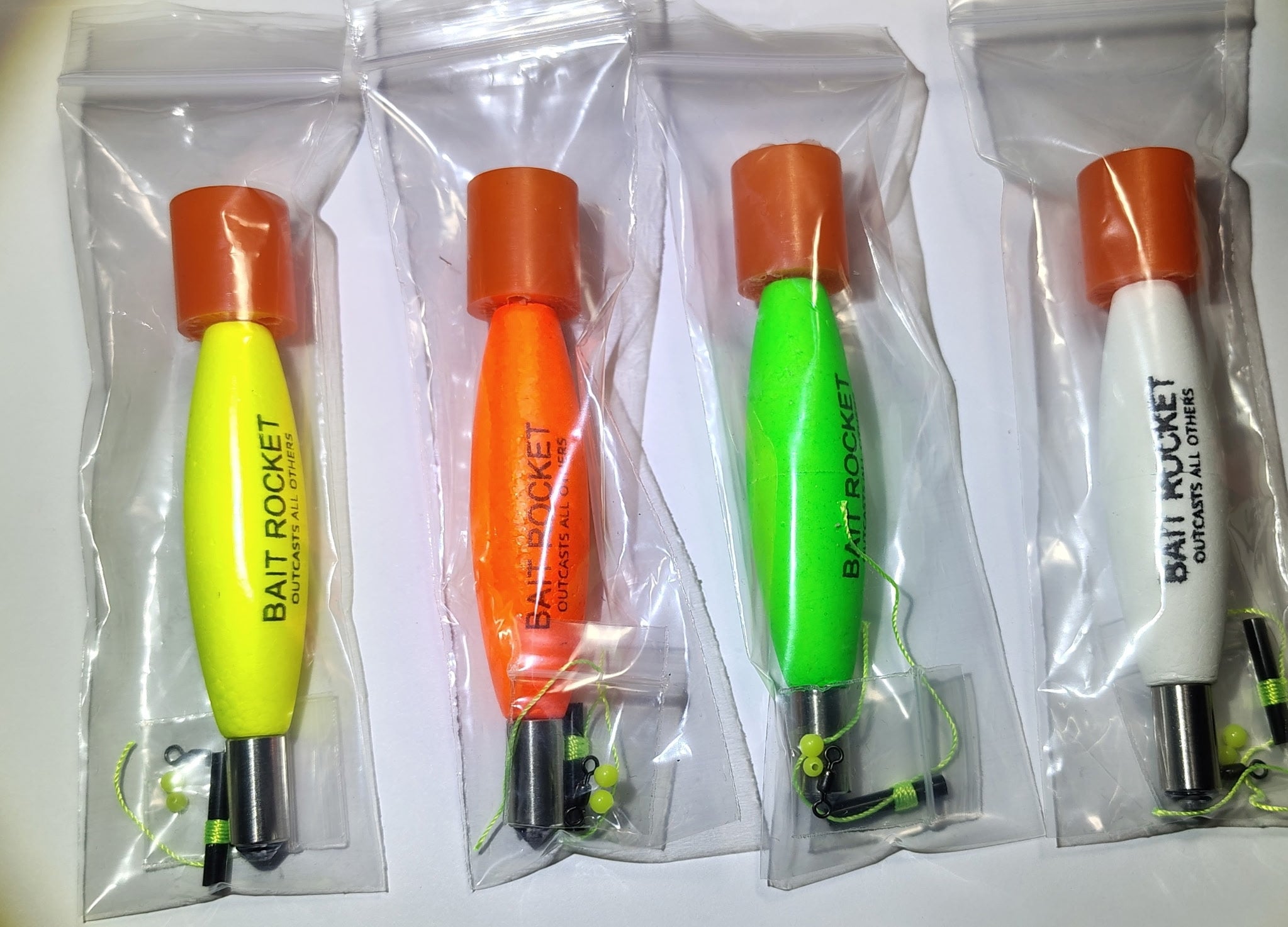 All four Bait Rocket™ Slip Float colorways — hi-vis yellow, blaze orange, atomic green and glow white — lined up in their packaging.